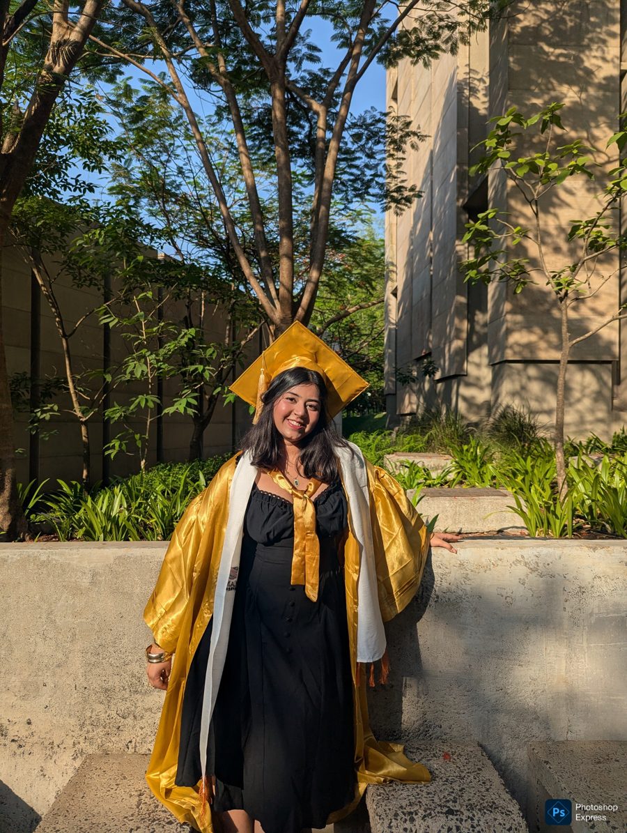 Arushi Arney in graduation cap and marigold gown at FLAME University
